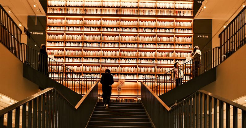 Shopping Experiences - A person walking up stairs in a library