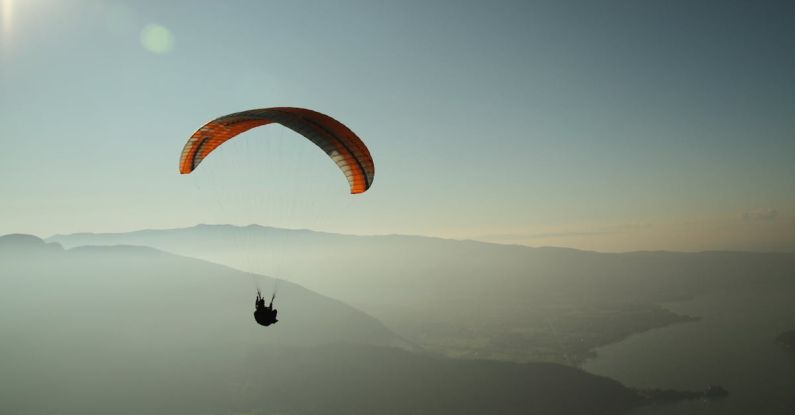 Paragliding - Man Using Parachute